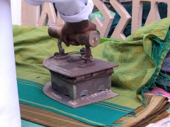 Box iron in India, 21st century Box iron with wooden handle pressing bright cloth