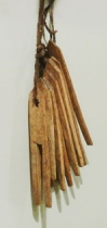 clothes pins crudely carved from flat piece of wood
