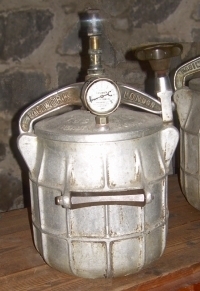 barrel-shaped canister with dial