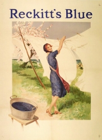 advertisement with woman hanging white washing on line near tub of blue water