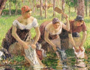 3 women kneeling by river with boards and washing bat