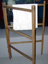 Simple folding drying rack with two leaves and white cloth